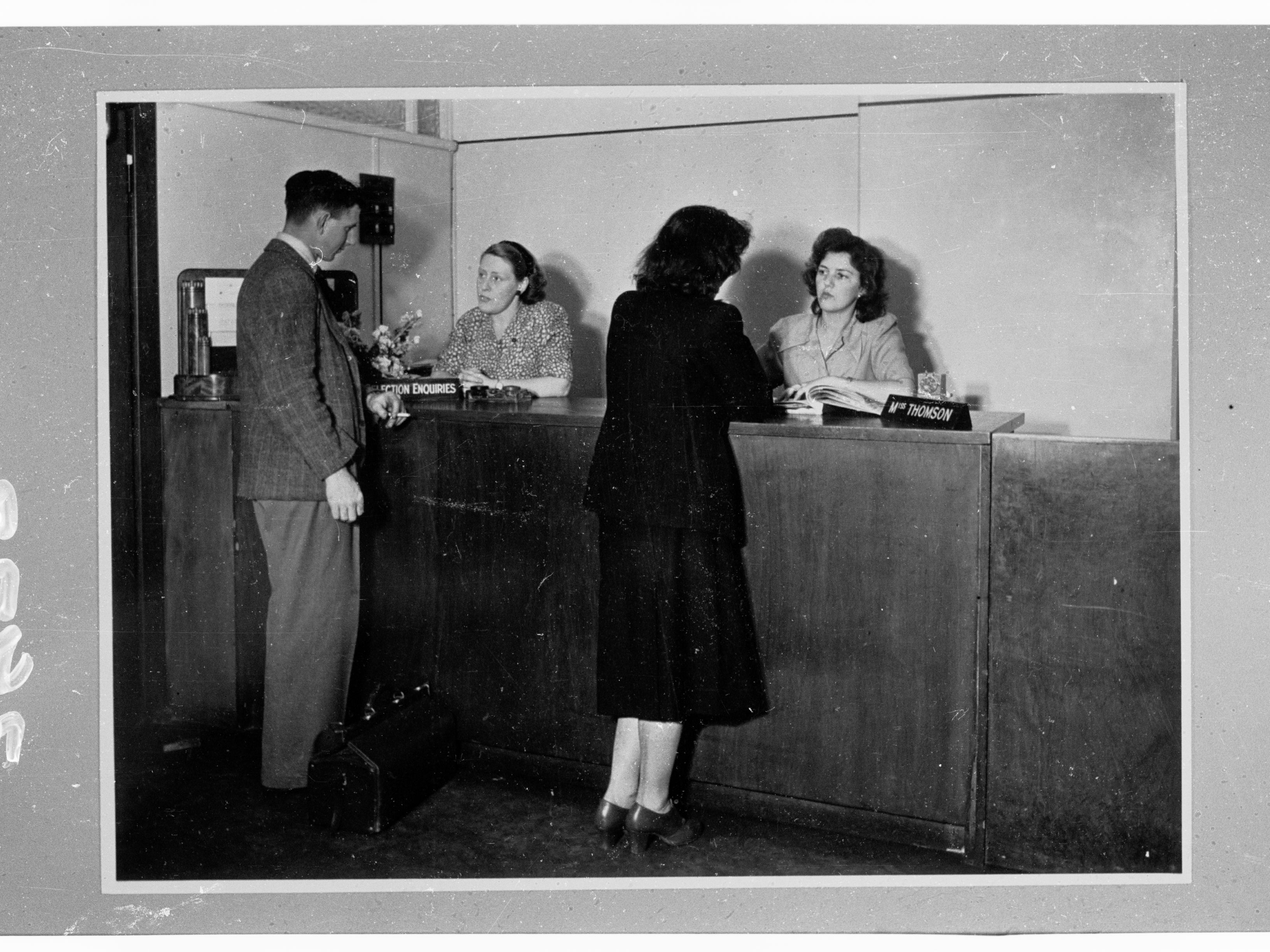 Empty bank teller counter with deposit slips